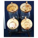 Set of 4 glass candy jars in metal rack