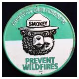 Round metal Smokey Bear sign
