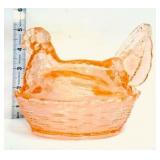 Orange glass hen on nest