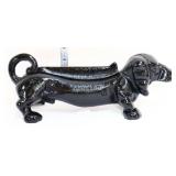 Black cast iron weenie dog boot scraper