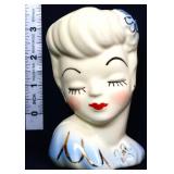 Vntg 4in lady head vase w/ blue flower in hair
