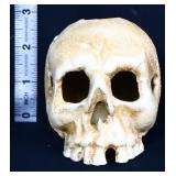 Small cast iron skull candlestick holder