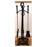 Set of black iron fireplace tools