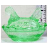 Miniature green hen on nest