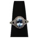 Sterling oval cut blue topaz ring, lab created