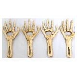 Lot of 4 cast iron skeleton hand bottle openers