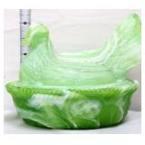 Green slag hen on nest