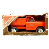 Red Tonka dump truck in org box