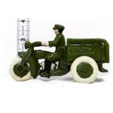 Cast iron man on green Harley motorcycle