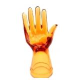 Orange glass jewelry hand