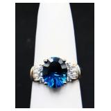 Sterling oval cut blue topaz ring, lab created