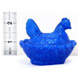 Miniature blue/white hen on nest