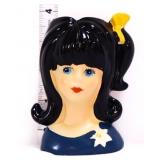 Lady head vase w/ black hair & yellow bow
