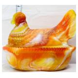 Orange slag hen on nest