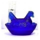 Miniature cobalt hen on nest
