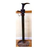Vintage cast iron shoe lasp on pedestal
