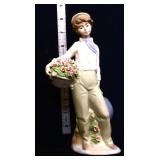 Vintage 8in Nadal porcelain boy w/ flower basket