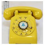 Vintage yellow plastic toy rotary phone