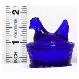 Miniature cobalt hen on nest