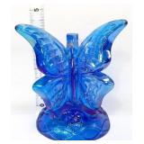 Fenton blue iridescent butterfly on branch