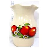 Vintage stone utensil jar with apples