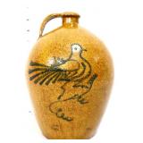 Stoneware whiskey jug w/ cobalt bird design