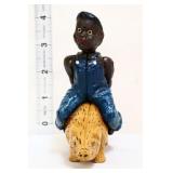 Cast iron americana boy on pig