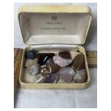 SEVERAL POLISHED ROCKS IN CASE