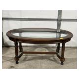 OVAL SHAPED GLASS TOP COFFEE TABLE