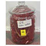 124 PLASTIC COOKIE CUTTERS IN VINTAGE GLASS JAR
