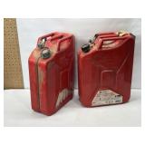 2 RED METAL JERRY CANS USED FOR DIESEL FUEL