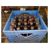 CRATE FULL OF COKE BOTTLES