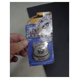 2004 PLASTIC TOY BADGE