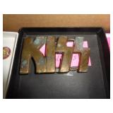SOLID BRASS KISS BELT BUCKLE