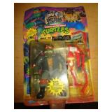 1993 TMNT FIGURE /PLASTIC COVER BROKE ON ONE SIDE
