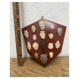 GROUP OF ARROWHEADS GLUED TO BOARD