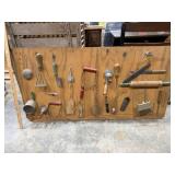 BOARD OF ANTIQUE KITCHEN UTENSILS