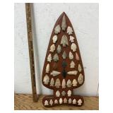 LARGE GROUP OF ARROWHEADS GLUED ONTO BOARD IN SHAP
