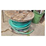 garden hose, wooden spool