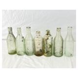 7 Antique Beer Bottles.