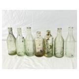 7 Antique Beer Bottles.