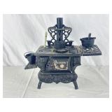 Childrenï¿½s Cast-Iron Play Wood Stove Set.