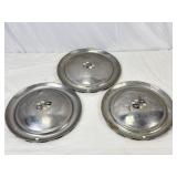 Three Matching Cadillac Wheel Covers.