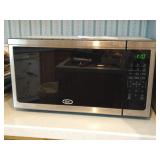 Oster 1.1 cu. ft. Countertop Microwave Model