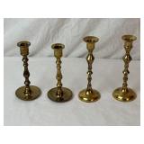 Four Miss-matched Brass Candle Sticks.