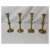 Four Miss-matched Brass Candle Sticks.