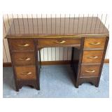 7 Drawer Wood Desk. 42In Wide, 29In T, 20In D.
