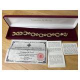 Camrose & Kross JBK Ruby Red Gold Tone Link