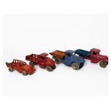(4) Antique Cast Iron Trucks (G)