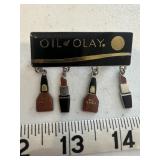 Oil of Olay Brooch